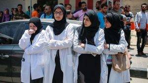 Medics attending the funeral of their colleague, Razan.